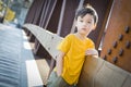 Mixed Race Boy Leaning on Bridge Outdoors Royalty Free Stock Photo