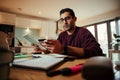 Mixed race business man making online purchase holding digital tablet making payment with credit card Royalty Free Stock Photo