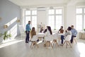 Diverse team of young business people having a corporate meeting in a modern office Royalty Free Stock Photo