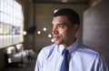 Mixed race businessman looking away smiling, close up Royalty Free Stock Photo