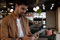 Mixed race businessman using digital tablet in creative office Royalty Free Stock Photo