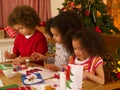 Mixed race children making Christmas cards Royalty Free Stock Photo