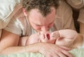 Mixed Race Chinese and Caucasian Baby Boy Laying In Bed with His Dad