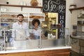 Mixed race couple behind the counter at a sandwich bar Royalty Free Stock Photo