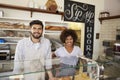 Mixed race couple behind counter at sandwich bar, close up Royalty Free Stock Photo