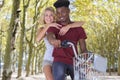 mixed race couple on bicycle