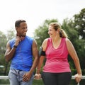 Mixed race couple exercising together in the park Royalty Free Stock Photo