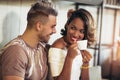 Mixed race couple having fun at the coffee shop Royalty Free Stock Photo