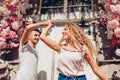 Mixed race couple in love dancing on city street. Young people having fun outdoors Royalty Free Stock Photo