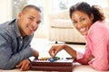 Mixed race couple playing solitaire Royalty Free Stock Photo