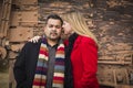 Mixed Race Couple Portrait in Winter Clothing Against Rustic Train