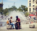 Mixed race couple relax at Karlsplatz in Munich