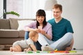 Mixed race family with baby son playing at home Royalty Free Stock Photo