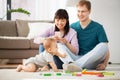 Mixed race family with baby son playing at home Royalty Free Stock Photo