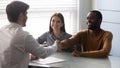 Smiling african american satisfied client shaking hands with salesman. Royalty Free Stock Photo