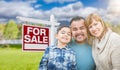 Mixed Race Family Portrait In Front of House and For Sale Real E Royalty Free Stock Photo