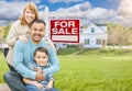 Mixed Race Family Portrait In Front of House and For Sale Real E Royalty Free Stock Photo