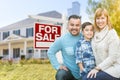 Mixed Race Family Portrait In Front of House and For Sale Real E Royalty Free Stock Photo