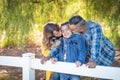 Affectionate Mixed Race Family Portrait Outdoors