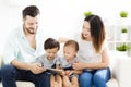 mixed race family watching the tablet Royalty Free Stock Photo