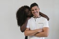 Mixed race family. Young tender wife hugging his husband. Loving Royalty Free Stock Photo