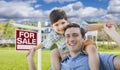 Mixed Race Father, Son Piggyback, Front of House, Sale Sign Royalty Free Stock Photo
