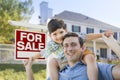 Mixed Race Father, Son Piggyback, Front of House, Sale Sign Royalty Free Stock Photo