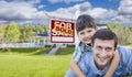 Mixed Race Father, Son Piggyback, Front of House, Sold Sign Royalty Free Stock Photo