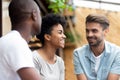 Mixed race female spending time with male friends Royalty Free Stock Photo