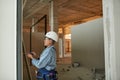 Mixed-Race Female Worker Building Wall Royalty Free Stock Photo