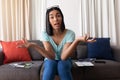 Mixed race gender fluid man working at home making video call, talking and gesturing Royalty Free Stock Photo