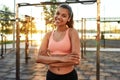 Mixed race girl on urban sport ground at sunset