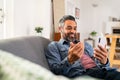 Mixed race man in video call with smartphone Royalty Free Stock Photo