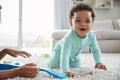 Mixed race mum and toddler son playing at home, close up Royalty Free Stock Photo