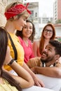 Group of happy smiling students having a great time at cafe bar