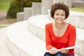 Mixed race student working outdoors Royalty Free Stock Photo