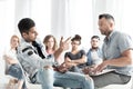 Mixed-race teenager talking to a school counselor in detention. Royalty Free Stock Photo