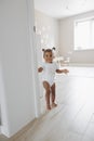 Mixed race toddler girl walking at room Royalty Free Stock Photo