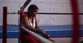 Mixed race woman in boxing gym