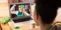 Mixed race woman having st patrick's day video call with happy female friend on laptop at home