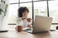 Mixed race young female communicating with coworker on online work meeting.Video call. Teamwork.