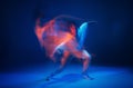 Mixed race young girl dancing in colorful neon studio light. Long exposure. Contemporary hip hop dance Royalty Free Stock Photo