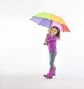 Mixed race young girl holding colorful umbrella Royalty Free Stock Photo