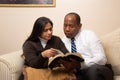 Mixed Raced Christian Couple Studying Bible Together