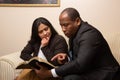 Mixed Raced Christian Couple Studying Bible Together