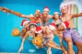 Mixed raced group of nine people celebrating christmas Royalty Free Stock Photo