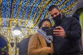 Mixed-races couple in masks taking selfie photos Royalty Free Stock Photo