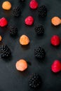 Mixed of red, black, yellow raspberries on table. Close up. Royalty Free Stock Photo