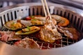 Mixed Roasted Meat and Seafood and Chopsticks on the BBQ Grill o Royalty Free Stock Photo