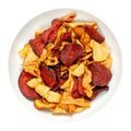 Mixed root vegetable crisps, sliced and fried root veg, in a white bowl